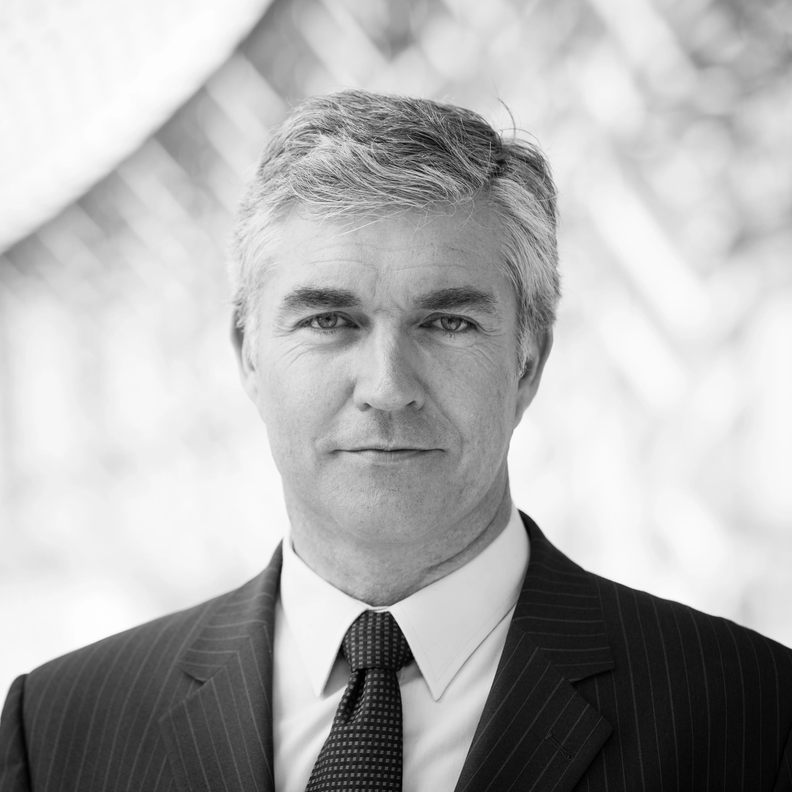 Professional headshot of an executive