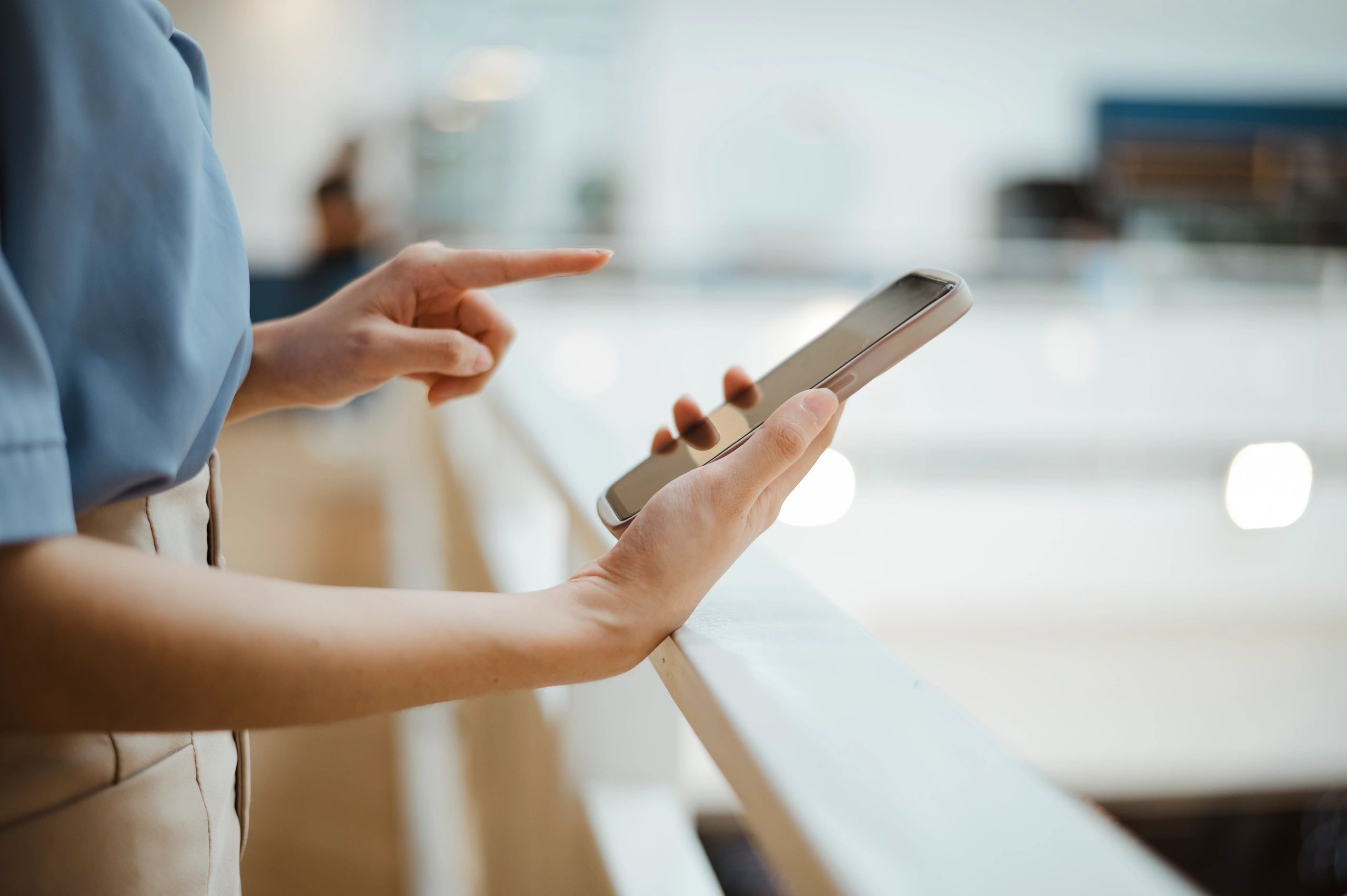 Person holding a smartphone, representing social media advertising